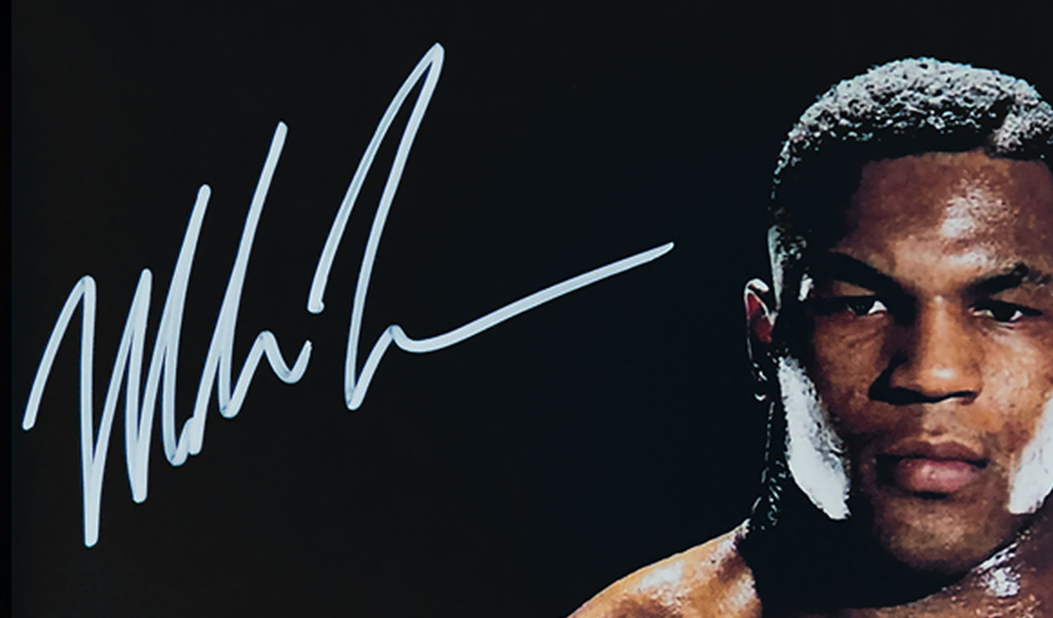 Mike Tyson autograph on signed photo in silver ink.
