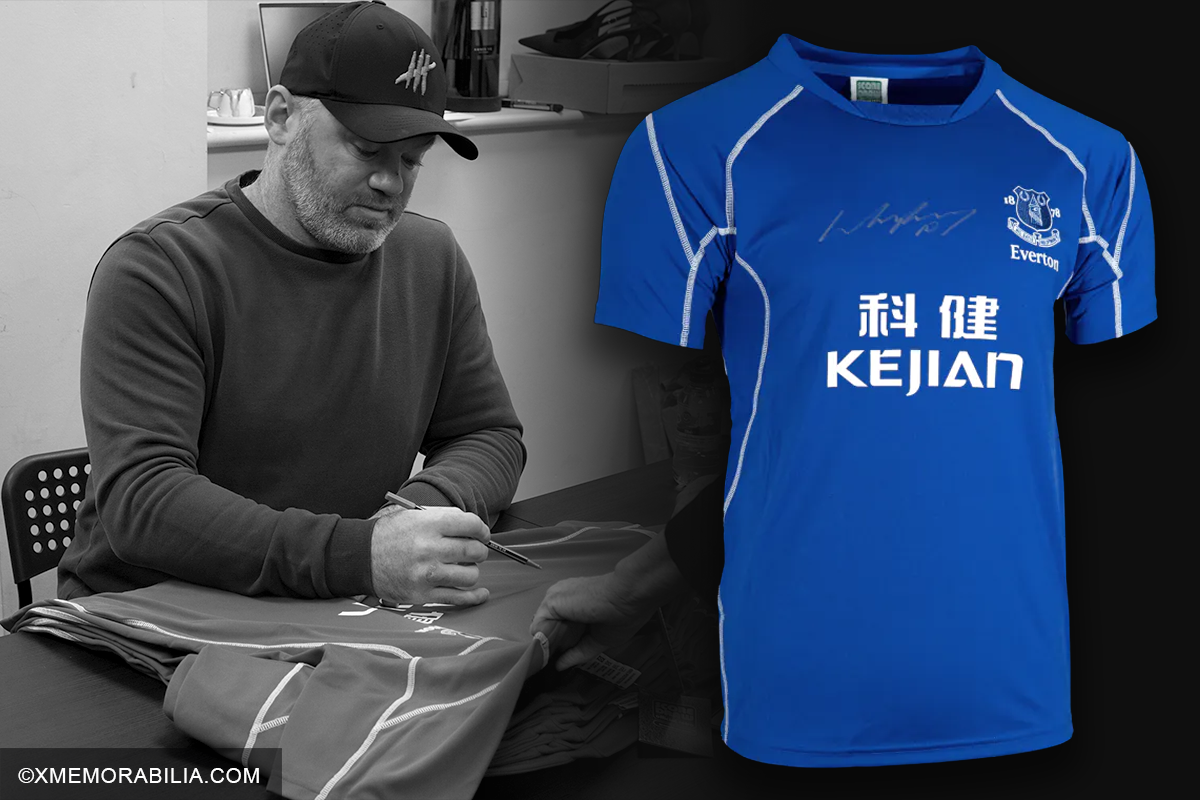 Wayne Rooney signing Everton shirt at autograph signing session in Manchester.