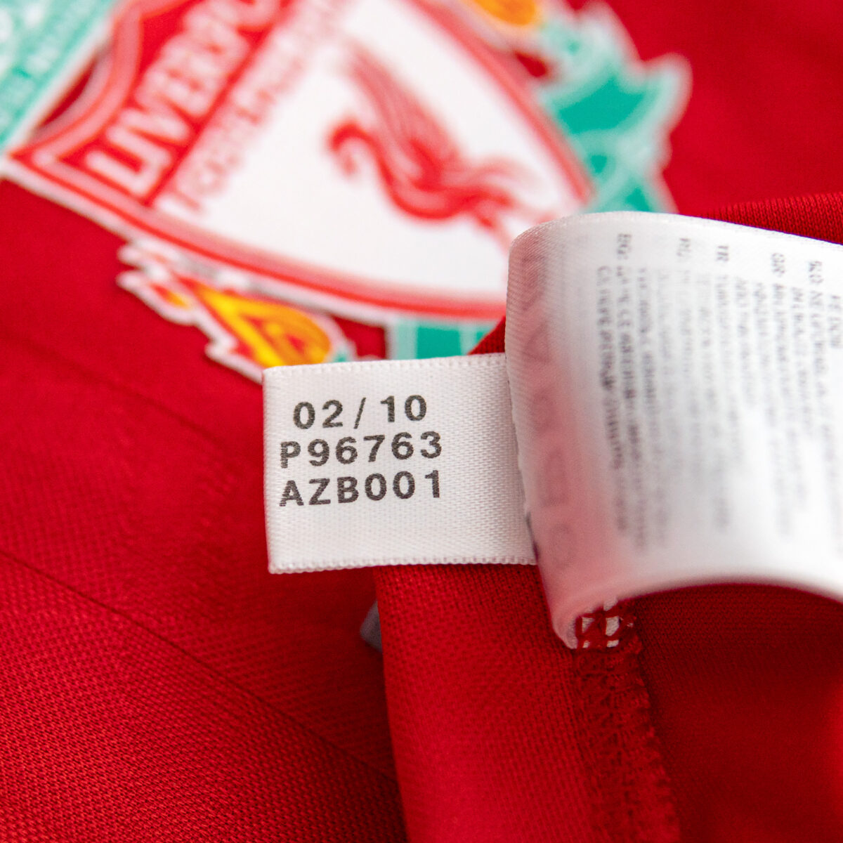 Example of the genuine adidas product code label shown on one of the Steven Gerrard signed Liverpool shirts available from X Memorabilia.