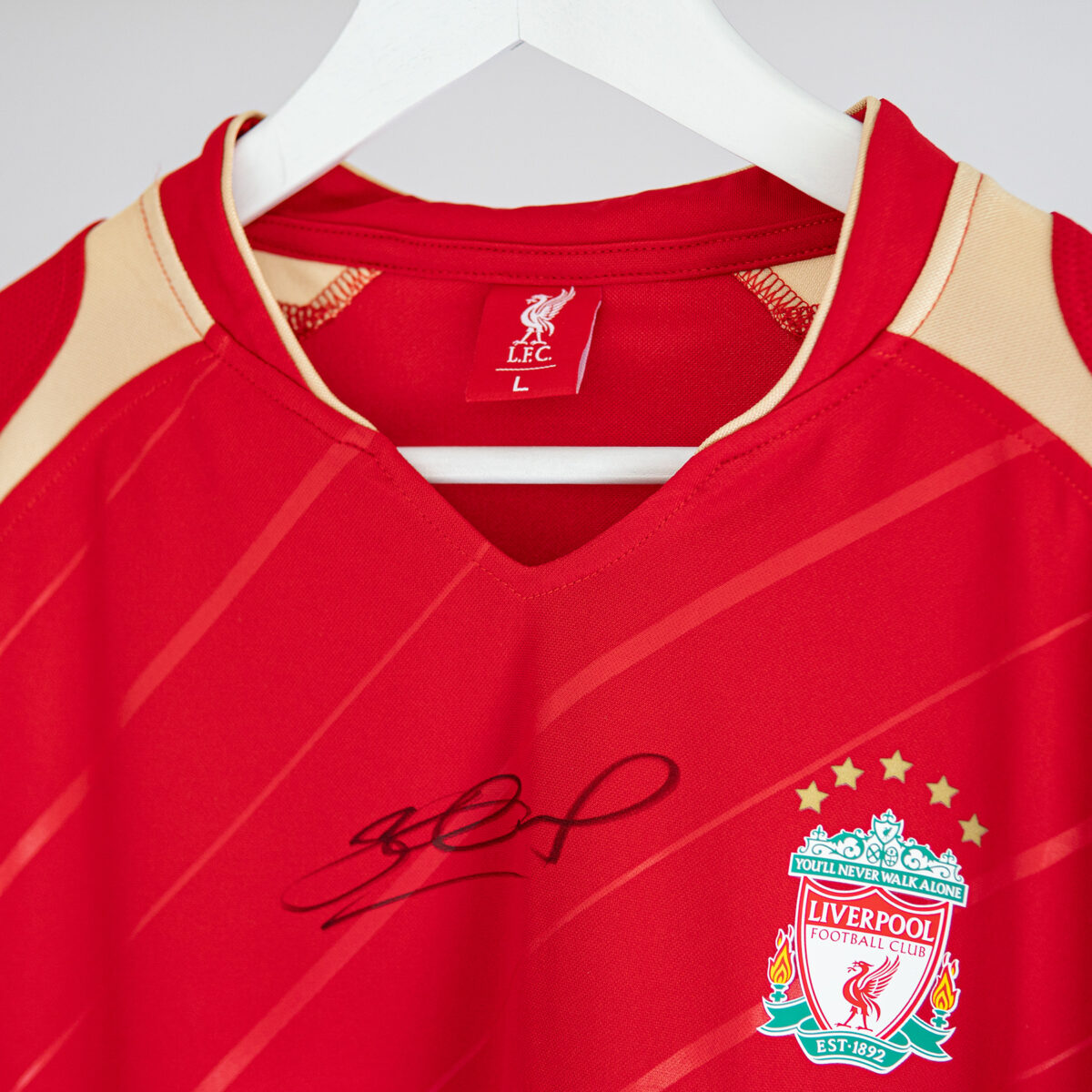 Close up of the autograph on the Steven Gerrard 2005/06 European home shirt.